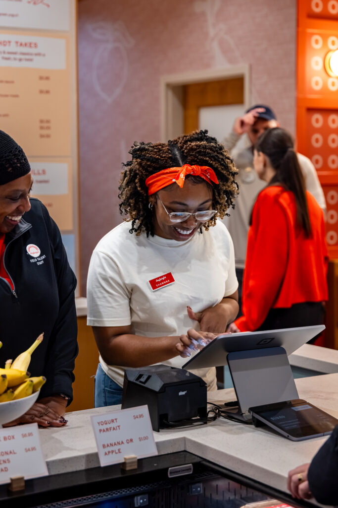A woman working at a cash register